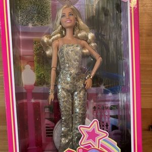 Barbie the Movie golden jumper doll